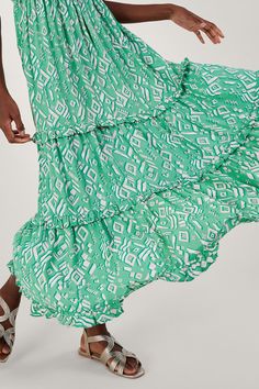 A hint of mint can be seen in the soft green hue of this dress, doused in a geometric print throughout the maxi length. It features soft ruffles through the trims with a shirred bodice and tiering towards the hem. Customise the fit: style the sleeves off the shoulder for a Bardot finish, or slip them up for a squared neckline. Green Maxi Dresses, Occasion Dresses Wedding Guest, Squared Neckline, Maxi Dress Collection, Petite Jumpsuit, Petite Coat, Green Maxi, Maxi Dress Green, Petite Outfits