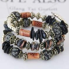 Beautiful handmade coil bracelet. Featuring a variety of delicately detailed stones, beads and charms. Perfect for every occasion. Pirate Jewelry, Jewelry Cheap, Multicolor Bracelet, Cheap Bracelets, Bohemian Bracelet, Bracelet Accessories, Clay Bracelet, Bohemian Accessories, Fashion Bohemian