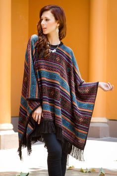 By Ana Fernandez this elegant poncho is knit of luxurious alpaca wool renowned for its lightweight warmth. Colorful and intricate geometric motifs are inspired by Mercedes Sosa's interpretation of Gracias a la vida a song by Chile's Violeta Parra. Alpaca Poncho, Color Block Shirts, Ladies Poncho, Wool Poncho, Knitted Poncho, Ladies Dress Design, One Piece Swimwear, Vintage Colors, Alpaca