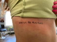 the back of a woman's leg with words written on it that says, we'll be alright