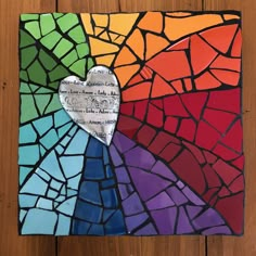 a piece of stained glass with a heart on it