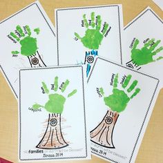 four handprints with trees on them