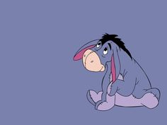 an animated donkey sitting on the ground with its head in his hands and tongue out