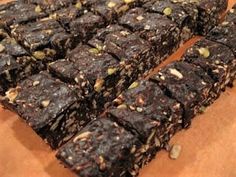 several pieces of brownie sitting on top of a wooden cutting board