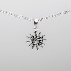 Introducing our exquisite 925 Sterling Silver Basque Flower Eguzkilore Pendant Necklace, meticulously handcrafted to capture the essence of Basque culture and tradition. The Eguzkilore, or Flower of the Sun, holds deep symbolic significance, embodying protection and strength. Measuring at a radiant 0.51" (13mm), this stunning pendant is accompanied by a premium 925 Sterling Silver chain, ensuring both elegance and durability. Customize your necklace to perfection by selecting your preferred leng Sterling Silver Heart Pendant With Flower Charm, Sterling Silver Heart Pendant With Flower Charm Jewelry, Sterling Silver Heart Pendant Necklace With Flower Charm, Sterling Silver Flower Pendant Necklace, Sterling Silver Snowflake Necklace In White Gold, White Gold Snowflake Necklace In Sterling Silver, White Gold Sterling Silver Snowflake Necklace, White Gold Snowflake Necklace, White Gold Sterling Silver Flower Pendant Necklace