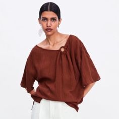 Brand: Zara Size: S Condition: Nwt Description: Zara Burnt Orange Reddish Brown Top. Super Cool Wooden Asymmetrical Ring Detail At Front. Draped Loose Oversized Blousy Fit. Perfect For Tucking In To High Waist Chic Asymmetrical Blouse For Beach, Brown Asymmetrical Summer Top, Zara Asymmetrical Tops For Day Out, Brown Zara Blouse For Summer, Orange Drapes, Asymmetrical Ring, Asymmetric Top, Brown Top, Reddish Brown