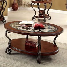 three tables with glass top sitting in a living room