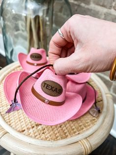 "Unleash your inner cowgirl with our Pink TX Cowgirl Hat and Windshield Charm! Whether you're riding through the wild west or cruising down the highway, this charming accessory will add a touch of howdy and girly pops to your style. Show off your love for Texas in the most fashionable way possible!" Adjustable Fun Hat For Western-themed Events, Fun Adjustable Mini Hats For Rodeo, Western Style Rodeo Mini Hat, Western Style Mini Hat For Western-themed Events, Adjustable Novelty Mini Hats For Festivals, Cute Adjustable Mini Hats For Festivals, Pink Adjustable Mini Hat For Rodeo, Pink Western Mini Hat For Rodeo, Pink Adjustable Hat For Western-themed Events