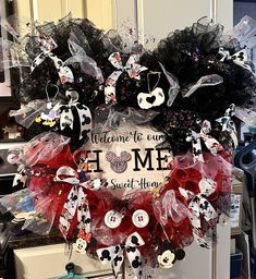 a welcome home wreath with mickey mouse decorations