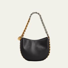 Stella McCartney shoulder bag in faux-leather. Two-tone chain shoulder strap woven onto bag; hanging engraved charm. Detachable, adjustable shoulder strap, 22.6" drop. Open top with snap closure. Interior, one slip pocket. Approx. 6.9"H x 8.5"W x 2.8"D. Item weighs approx. 1.9 lb. "Frayme" is made in Italy. Luxury Shoulder Bag With Chain In Crossbody Style, Luxury Chain Crossbody Shoulder Bag, Luxury Chain Shoulder Bag Crossbody, Luxury Chain Shoulder Crossbody Bag, Leather Shoulder Baguette Bag With Chain Strap, Formal Tote Shoulder Bag With Chain Strap, Leather Chain Strap Baguette Shoulder Bag, Top Handle Bag With Chain For Everyday Use, Leather Tote Shoulder Bag With Chain Strap