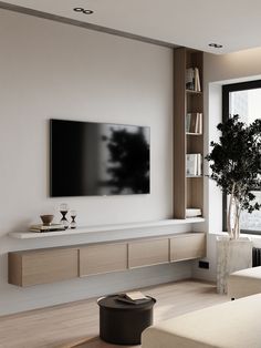 a large flat screen tv mounted to the side of a wall in a living room