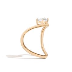 The curve collection was inspired by the “queen of the curve”, Zaha Hadid, who was known for playing with all 360 degrees of the angle. The organic series aims to seamlessly allow the metal, stone, and skin to flow into one. A claw-set half-moon diamond is nestled inside the curve of this band. Shahla Karimi, Half Rings, Curve Ring, Zaha Hadid, Rough Diamond, Recycled Gold, Gold Platinum, Half Moon, Gold Bands