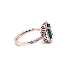 Introducing a stunning Brazilian Green Tourmaline and Diamond Dinner Ring, a timeless piece that exudes elegance and sophistication. This exquisite ring features a gleaming emerald-cut bluish-green Tourmaline, measuring 8.25 x 7.5 MM and weighing an estimated 2 carats. The center stone is beautifully enhanced by a dazzling pave diamond halo (estimated 0.35 carat total weight), with G/H color and SI2 clarity, and additional diamonds adorning the shank. Set in a handcrafted 14K white gold setting, this ring is a size 6.5 (no alterations by the seller).  Tourmaline is a gemstone of extraordinary color, often mistaken for rubies or emeralds before being officially recognized in the 1800s. Few gems can match Tourmaline's vibrant spectrum, with each color holding unique symbolism. Green Tourmali Formal Emerald Halo Ring Fine Jewelry, Classic Emerald Cut Gemstone Halo Ring, Elegant Emerald Cut Ring With Halo Design, Elegant Emerald Cut Emerald Ring With Halo Design, Elegant Green Sapphire Ring Gia Certified, Formal Emerald Cut Emerald Ring With Halo, Formal Princess Cut Emerald Ring For May Birthstone, Formal Emerald Cut Sapphire Ring With Halo Setting, Formal Gia Certified Green Sapphire Ring