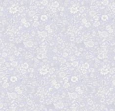 a white and blue wallpaper with small flowers on the top right corner, in an ornate pattern