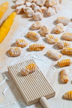 several pastries are laying on a baking sheet