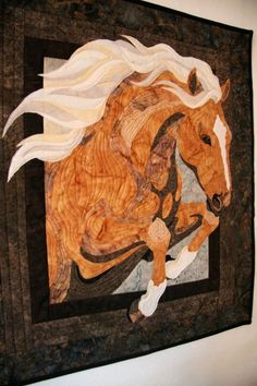 a horse is depicted on a wall hanging