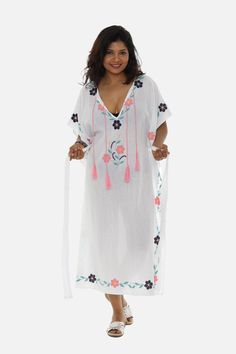 This Kaftan is as delicate and feminine as a midsummer night's dream. The lovely caftan features intricately embroidered floral motifs in soft and feminine pastel hues. The hand-free sleeves and generous neckline complete this bohemian ensemble.