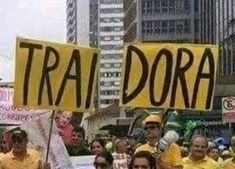 a group of people holding up signs in the street