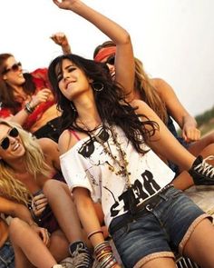 a group of young women sitting next to each other