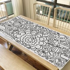 a dining room table with an artistic design on it