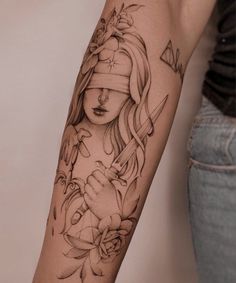 a woman's arm with a tattoo on it