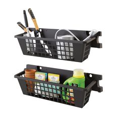 two black baskets with utensils and cleaning supplies in them on a white background