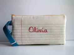 a small bag with the word olvia written on it