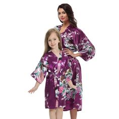 Floral Purple Mommy and Me Robes for women and girls. Available for girls, ranging from toddlers to tweens in sizes 2T to 14 and for womens/womens plus from sizes 2 to 38. These versatile, lightweight robes are great for any occasion. Its great for just lounging around the home, getting ready, or to use while on vacation and more. Other colors are available in other listings. Womens robes are available in sizes small (2/4), medium (6/8), large (9/10), xlarge (11/12), xxl (13/14) and xxxl (15/18) Long Silk Kimono, Pretty Robes, Robes For Women, Plus Size Robes, Kids Robes, Couple Pajamas, Pyjamas Womens, Short Kimono, Peacock Design