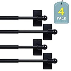 four black curtain rods with 4 hooks on each side and one for the top, all in