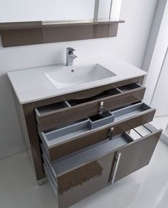 a bathroom vanity with two drawers and a sink in the middle, along with a rug on the floor