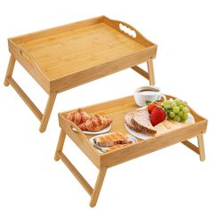 two wooden trays with food on them