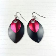 These on trend earrings with colored aluminum shapes in team colors are also great for any after parties with a quick change of clothes.
Gorgeous lightweight petal shaped dangles in black and gold for game day (or any day)that are suspended from gold plated ball tipped French wires. These earrings measure 1 1/2 in long x 1 in wide. Trend Earrings, Atlanta United, Red Wolf, Texas Tech Red Raiders, Red Raiders, Texas Tech, French Wire, Etsy Earrings Dangle