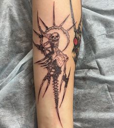 a person with a skeleton tattoo on their arm