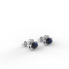 Dress up with these sophisticated pair of Sapphire earrings full of sparkle and chic`They look so perfectly beautiful it's instantly classic.- Made to Order, perfectly finished, Fast shipping fully insured and trackable online.- Sapphire information: Two 6x4mm oval cut Sapphire corundum 1.02 ctw- Diamond information: 6 x Diamonds, VS-E, 0.08 ctw- Arrives gift ready with a certificate of authenticity. Classic Diamond Drop Earrings For Everyday Luxury, Classic Diamond Cut Earrings For Evening, Classic Diamond Accented Earrings For Evening, Elegant Oval Cluster Earrings With Brilliant Cut, Elegant Oval Diamond Cluster Earrings, Elegant Yellow Gold Cluster Earrings In Sterling Silver, Elegant Yellow Gold Sterling Silver Cluster Earrings, Elegant Oval Cluster Earrings With Prong Setting, Elegant Oval Cluster Earrings In Yellow Gold