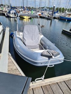 an inflatable boat is docked at the dock