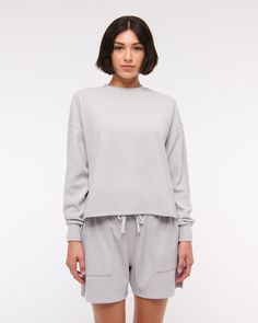 Comfy long-sleeve tee in our softAF fabric and oversized-fit silhouette, featuring an all-over grid micro-waffle texture, crew neckline and straight hem. Trendy Tops With Soft Texture For Loungewear, Cotton Athleisure Tops With Soft Texture, Casual Long Sleeve Solid Color Top For Loungewear, Casual Long Sleeve Top For Loungewear, Spring Sporty Long Sleeve Top Relaxed Fit, Spring Athleisure Long Sleeve Top With Relaxed Fit, Cozy Fit Tops For Everyday Spring Wear, Sporty Long Sleeve Top Relaxed Fit For Spring, Spring Cozy Fit Top For Everyday