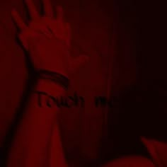 a person holding their hand up with the word touch me written on it