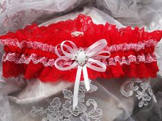 Made in sizes 14"-26" garter width is 2.95" Please send the circumference of your leg after making the purchase. I will make a garter according to your information. How to Measure for a Wedding Garter ~ Wrap a measuring tape around your thigh where you plan to wear your garters. Garters are typically worn about 3 inches above the knee. Look at the number where the measuring tape overlaps itself. This is the size of your thigh, which will guide you in knowing what size garter you'll need. Write i Red And White Wedding, Prom Garters, Red And White Weddings, Garter Wedding, Wedding Garters, Lace Garter, Red Belt, Wedding Garter, How To Measure