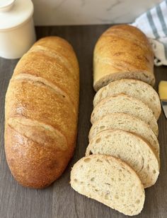 a loaf of bread sitting on top of a cutting board