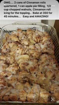 a pan filled with cinnamon rolls covered in icing