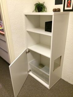 an open book shelf in the corner of a room