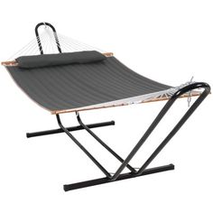 the hammock is attached to a stand with two straps on each side and an adjustable