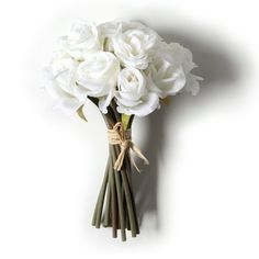 a bouquet of white roses tied to a wall