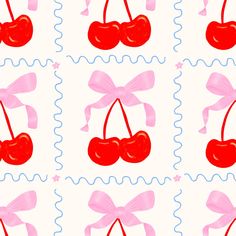 an image of cherries with bows on them