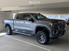 a silver truck parked in a parking garage