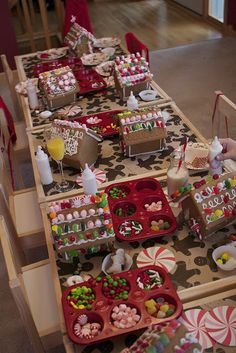 the table is set up with candy and candies on it for a holiday party