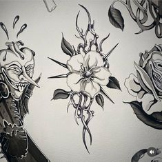 a drawing of roses and skulls on a wall