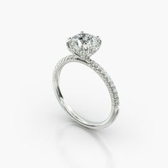 a diamond engagement ring on a white background