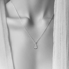 Introducing our stunning Teardrop Diamond Pendant, where classic meets contemporary. This pendant showcases a magnificent pear-shaped diamond paired seamlessly with a delicate marquise diamond, set in your choice of either 18k white gold or platinum. The unique combination of these two diamond cuts creates an enchanting play of light, making it an ideal accessory for those who appreciate both modern design and timeless elegance. This pendant is not just jewelry, but a statement of refined taste. Platinum Marquise Necklace For Wedding, Wedding Platinum Marquise Necklace, Timeless Silver Marquise Diamond Necklace, Silver Diamond Necklace With Marquise Prong Setting, Silver Pear-shaped Jewelry With Brilliant Cut, Silver Jewelry With Brilliant Cut Pear Shape, Elegant Teardrop Solitaire Necklace For Gift, Timeless Marquise Diamond Necklace For Wedding, Brilliant Cut Marquise Diamond Necklace For Wedding