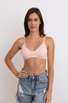 The Seamless Lettuce Edge Bow Tie Triangle Bralette combines comfort and charm seamlessly. Crafted with seamless technology for a smooth fit, this bralette features delicate lettuce edge detailing that adds a touch of femininity. Perfect for everyday wear or layering under your favorite outfits, it effortlessly blends style with ease. Ideal for those who value both comfort and a hint of whimsical elegance in their lingerie collection. #lovemyleto 92% Nylon, 8% Spandex Imported Seamless Cropped Bra, Seamless Solid Cami Bra, Solid Color Seamless Cami Bra, Seamless Cami Bra For Spring, Summer Seamless Stretch Nursing Bra, Cropped Seamless Stretch Bra, Seamless No-show Nursing Bra, Spring Seamless Cami Bra, Low-cut Stretch Bra For Spring